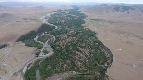 Aerial-drone-shot-of-a-river-in-Mongolia-high-altitude-Cloudy-day
